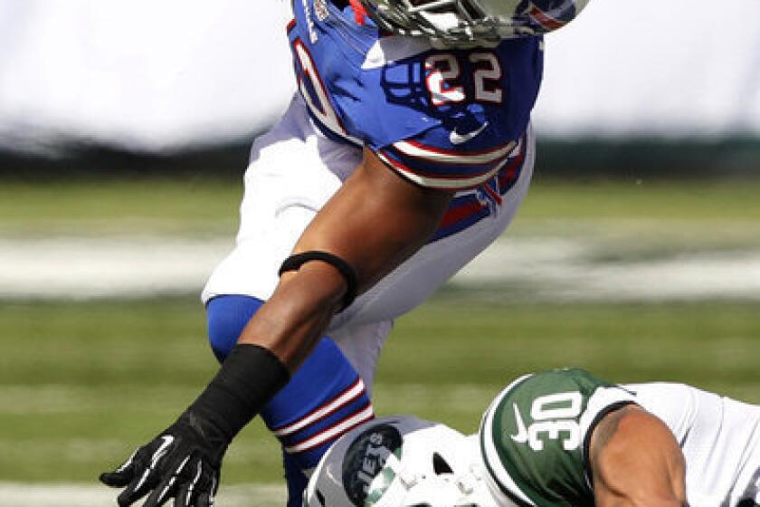 Buffalo Bills running back Fred Jackson is hit by New York Jets defensive back LaRon Landry during the first half. Jackson was injured on the play.