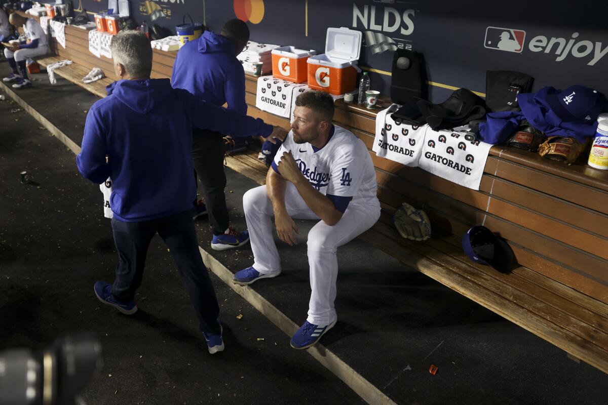 Blake Treinen sits in the dugout during Game 2.