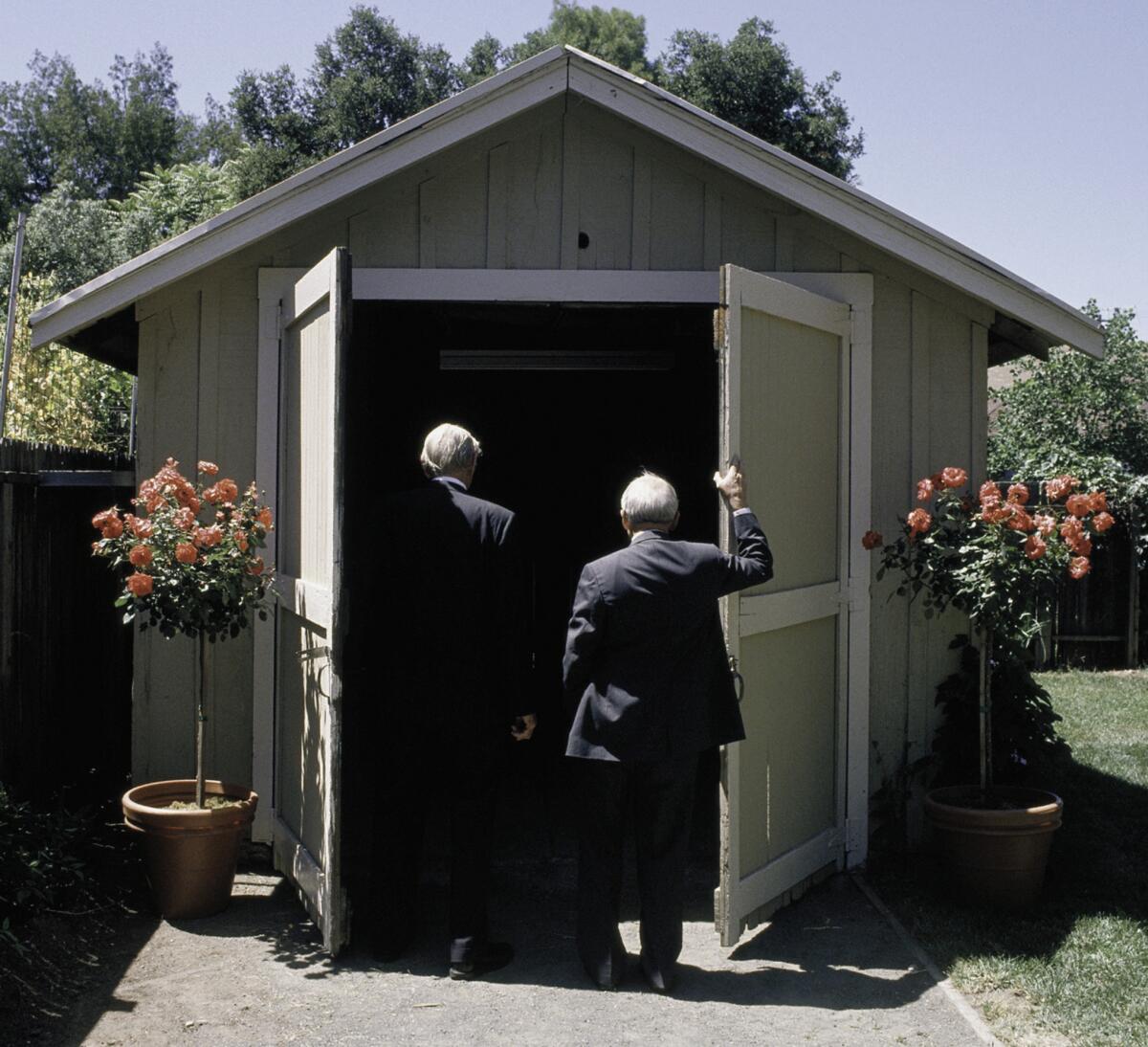 David Packard (left) and Bill Hewlett took another look at the garage where their company was born during a 1989 ceremony marking its dedication as a state landmark.