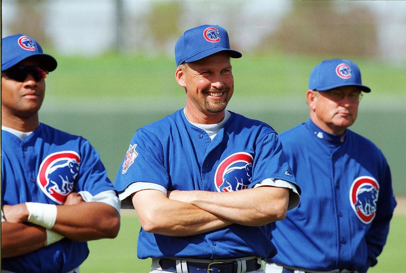 Mark Grace (center) smiles after being introduced at Cubs spring training in 2000.