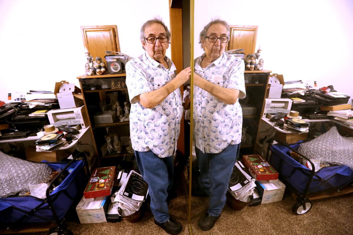 Ken Mattlin is reflected in mirror at his home in Bakersfield.