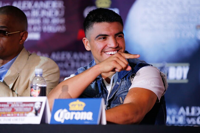 Victor Ortiz, shown at a promotional event in November, was arrested along with his brother for allegedly assaulting a man Saturday at the Kenny Chesney concert at the Rose Bowl in Pasadena.