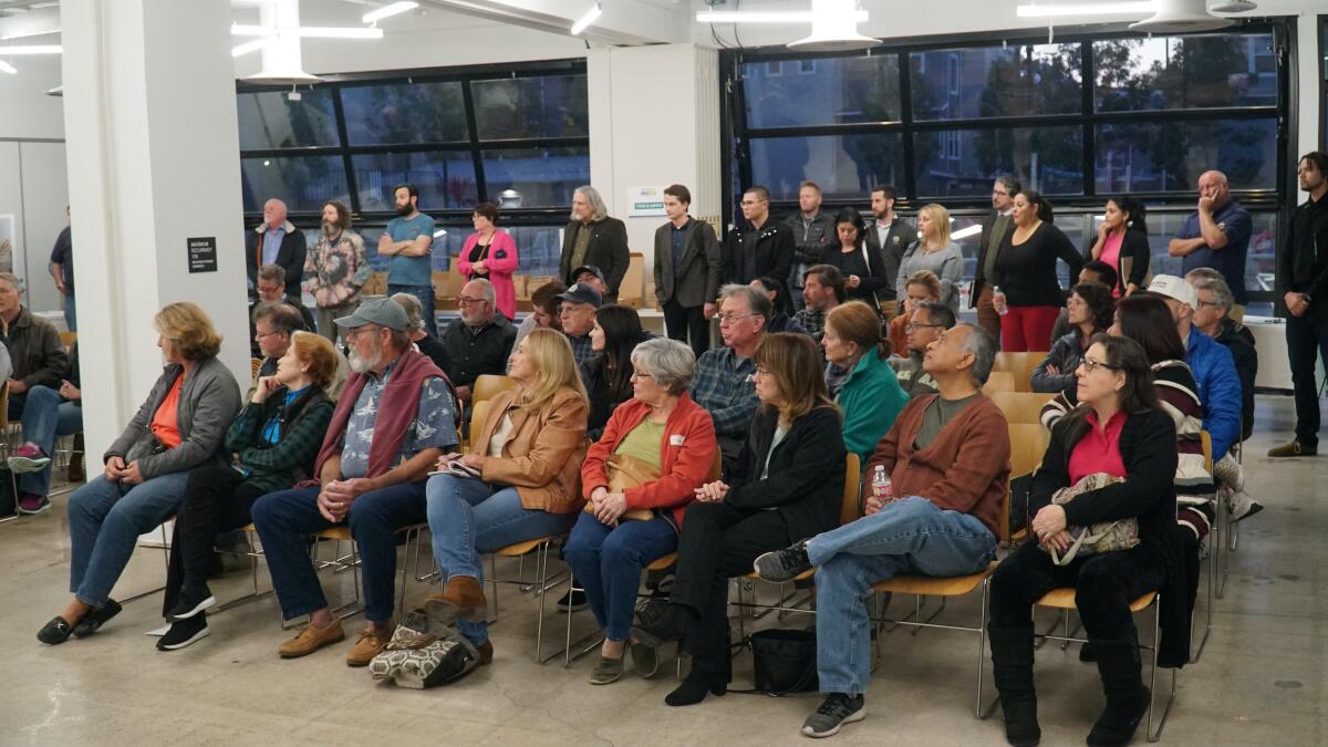 A portion of the crowd listens during Midway Rising's first community outreach meeting Feb. 8.