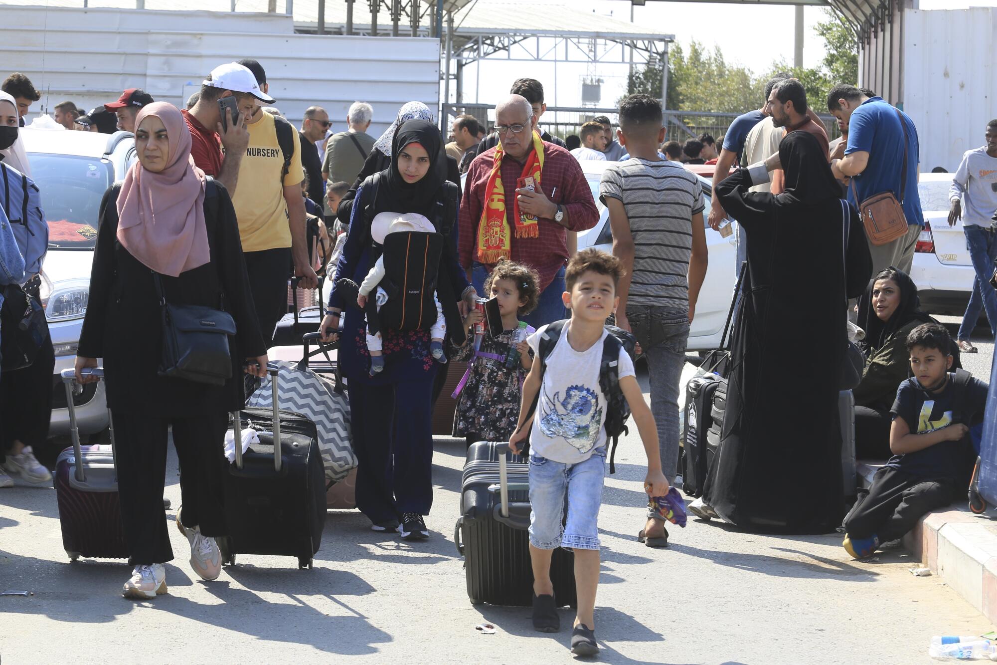 Palestinians waiting at the Rafah border crossing between the Gaza Strip and Egypt