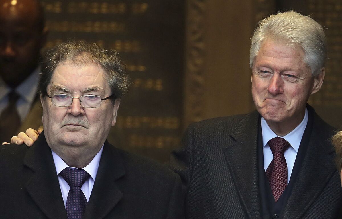 Former US President Bill Clinton with John Hume at the Guildhall in Londonderry, Northern Ireland in 2014.