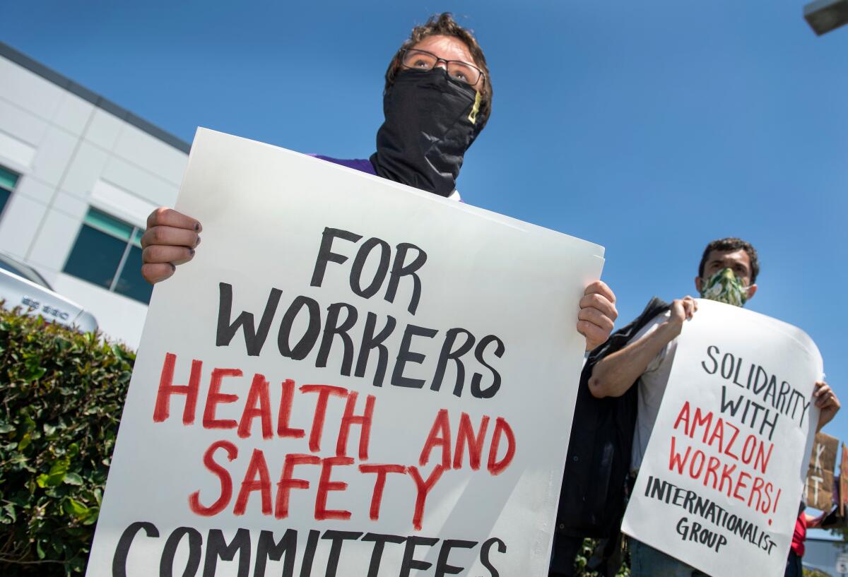 Workers demonstrate at the Amazon delivery hub in Hawthorne on May 1.