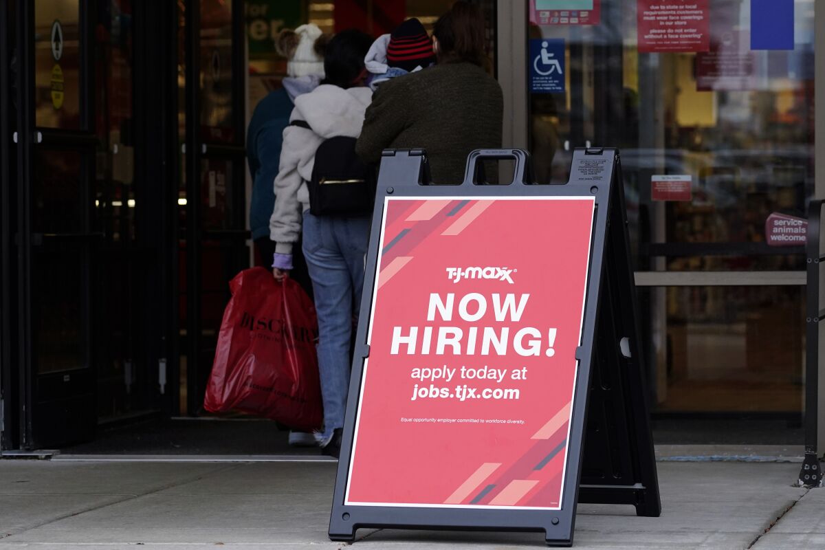 FILE - Hiring sign is displayed outside of a retail store in Vernon Hills, Ill., on Nov. 13, 2021. Fewer Americans applied for jobless aid last week with the number of Americans collecting unemployment at historically low levels. Applications for unemployment benefits fell by 11,000 to 200,000 for the week ending May 28, the Labor Department reported Thursday, June 2, 2022. First-time applications generally track the number of layoffs. (AP Photo/Nam Y. Huh, File)