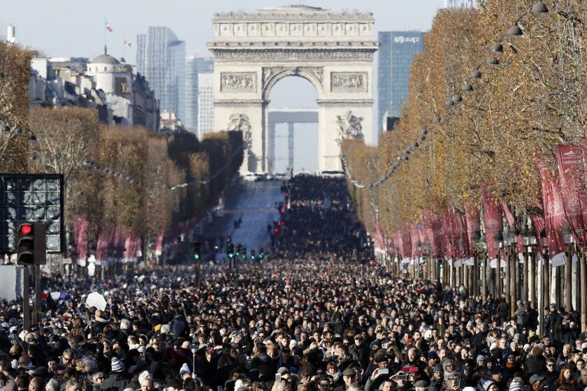 Mandatory Credit: Photo by ETIENNE LAURENT/EPA-EFE/REX/Shutterstock (9265577ep) Thousands of persons gather at the passage of the funeral cortege with the coffin of late French rock legend Johnny Hallyday as it drives down the Champs Elysees avenue to the Concorde Square ahead of the tribute ceremony in Paris, France, 09 December 2017. Johnny Hallyday, France's biggest rock star, has died of cancer on 06 December. He was 74. Tribute to Johnny Hallyday in Paris, France - 09 Dec 2017 ** Usable by LA, CT and MoD ONLY **