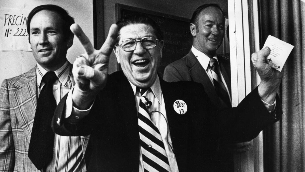 Howard Jarvis, chief sponsor of Proposition 13, signals victory as he casts his vote at the Fairfax-Melrose precinct in 1978.