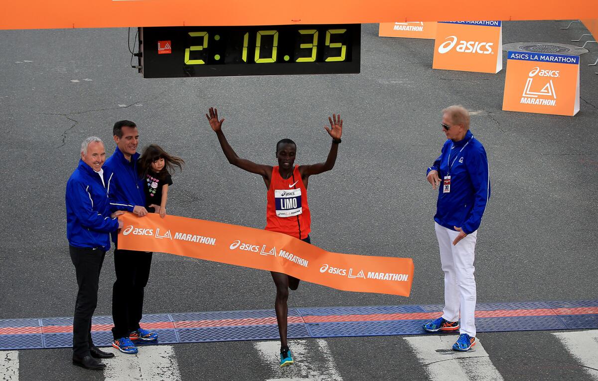 Daniel Limo of Kenya crosses the finish line to win the 30th Los Angeles Marathon.