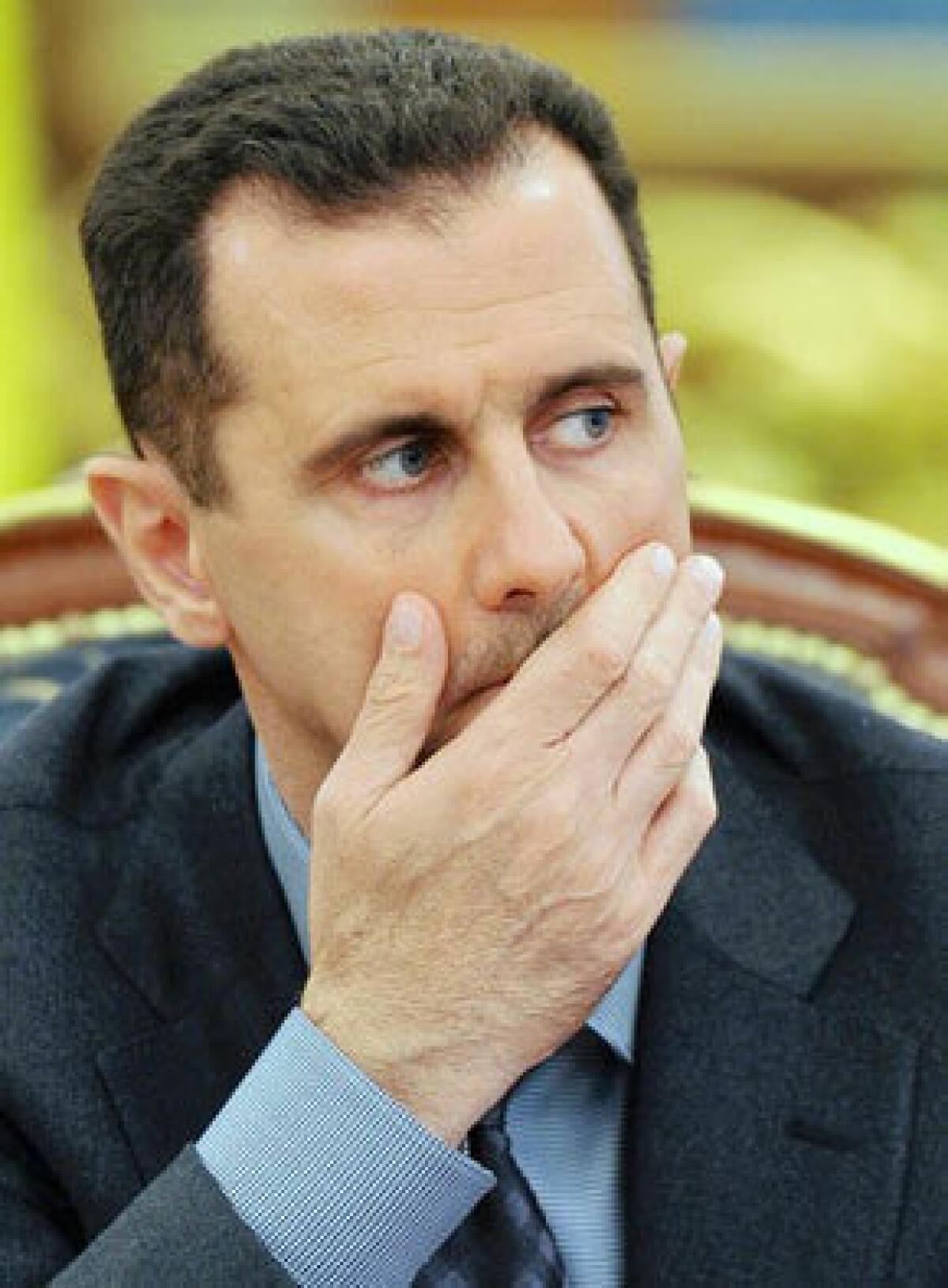 Syrian President Bashar Assad, in a rare interview with a Western newspaper, told Britain's Sunday Times that he will negotiate with rebels only if they give up their arms.