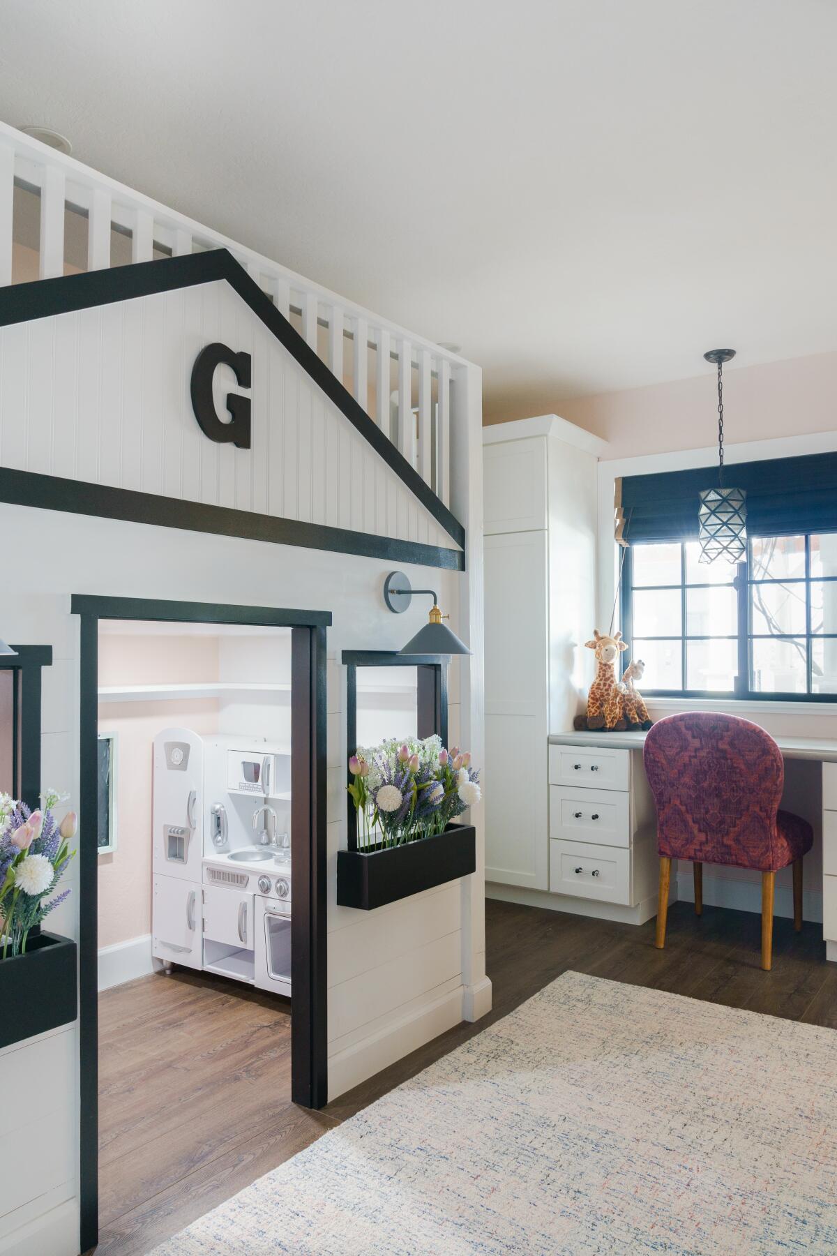 A "farmhouse luxe" girls room, complete with window boxes and a playhouse.