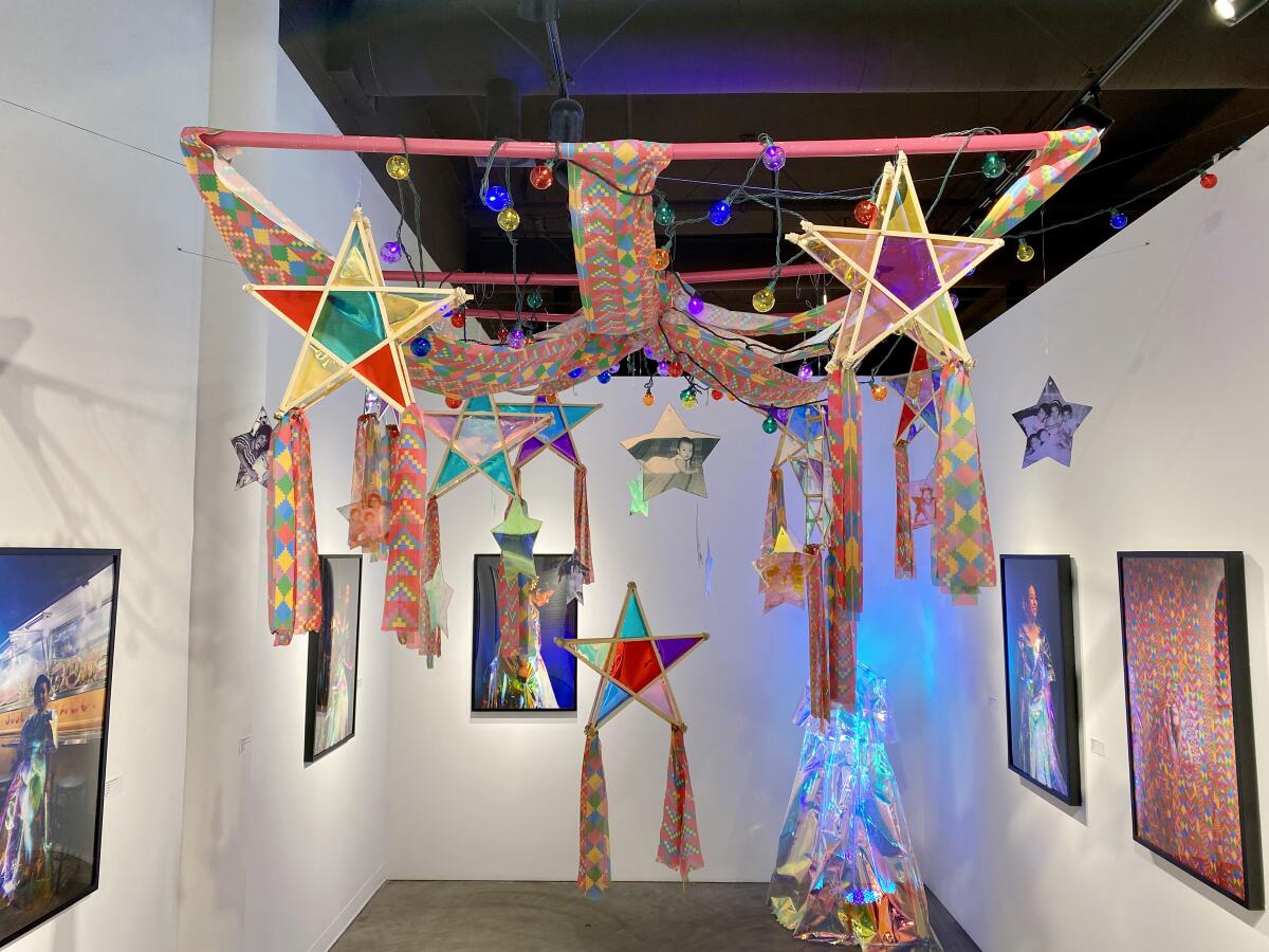Installation view of Jaana Baker's holographic dress from the series "Poppies and Sampaguitas" at the Brea Art Gallery.