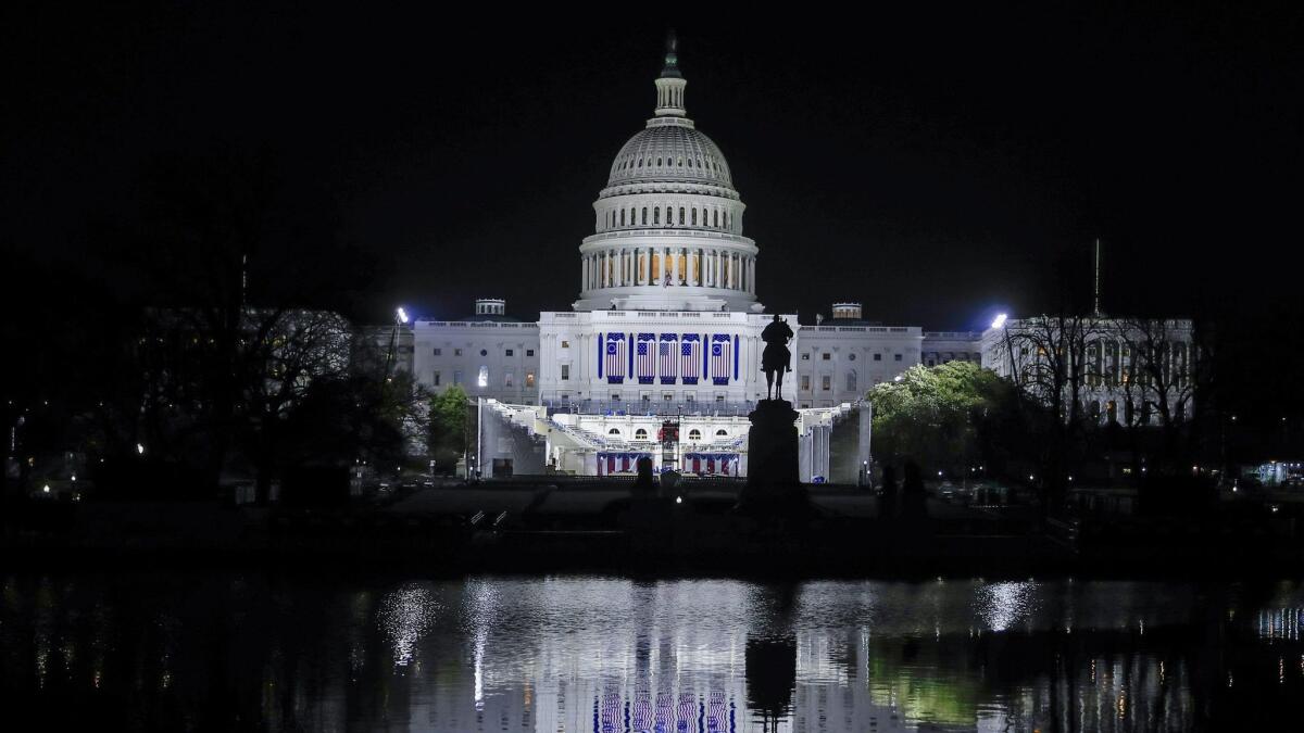 The U.S. Capitol is illuminated in advance of Donald Trump's inauguration in Washington, D.C.
