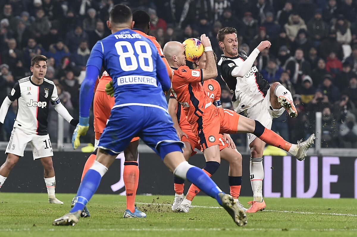 Juventus' Daniele Rugani, right, in action during the Italian Cup soccer match between Juventus and Udinese, at the Allianz Stadium in Turin, Italy, Wednesday, Jan. 15, 2020. (Fabio Ferrari/LaPress via AP)