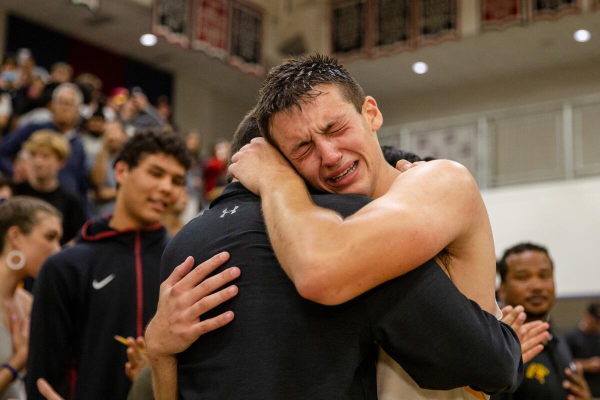 Torrey Pines High's Nick Herrmann (1) becomes emotional after his game-winning shot on Saturday night.