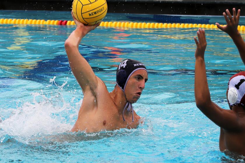 Newport Harbor's Connor Ohi (14) shoots for a goal during Newport Harbor High School's water polo team against Harvard-Westlake High School's water polo team in the South Coast Tournament at Corona del Mar High School in Newport Beach on Saturday, September 14, 2024. (Photo by James Carbone)