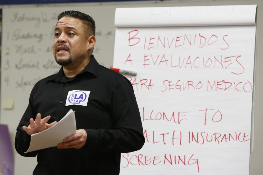 Organizer Edward Chavez of One LA speaks at a health screening event for enrollees in California's Medicaid program, Medi-Cal, last year.