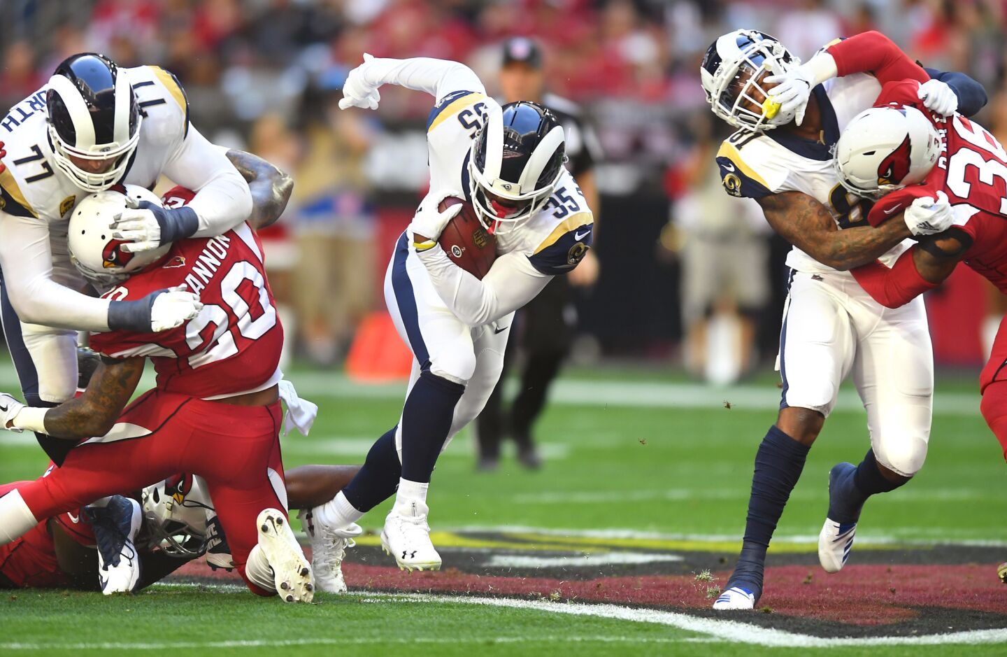 Rams' C.J. Anderson picks up yards against the Arizona Cardinals in the first quarter at State Farm Stadium on Sunday.