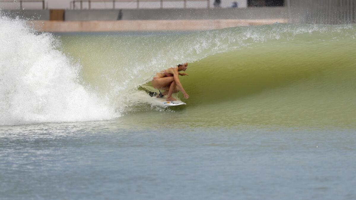 Bianca Buitendag gets covered up by a perfectly sculpted 7-foot high left.