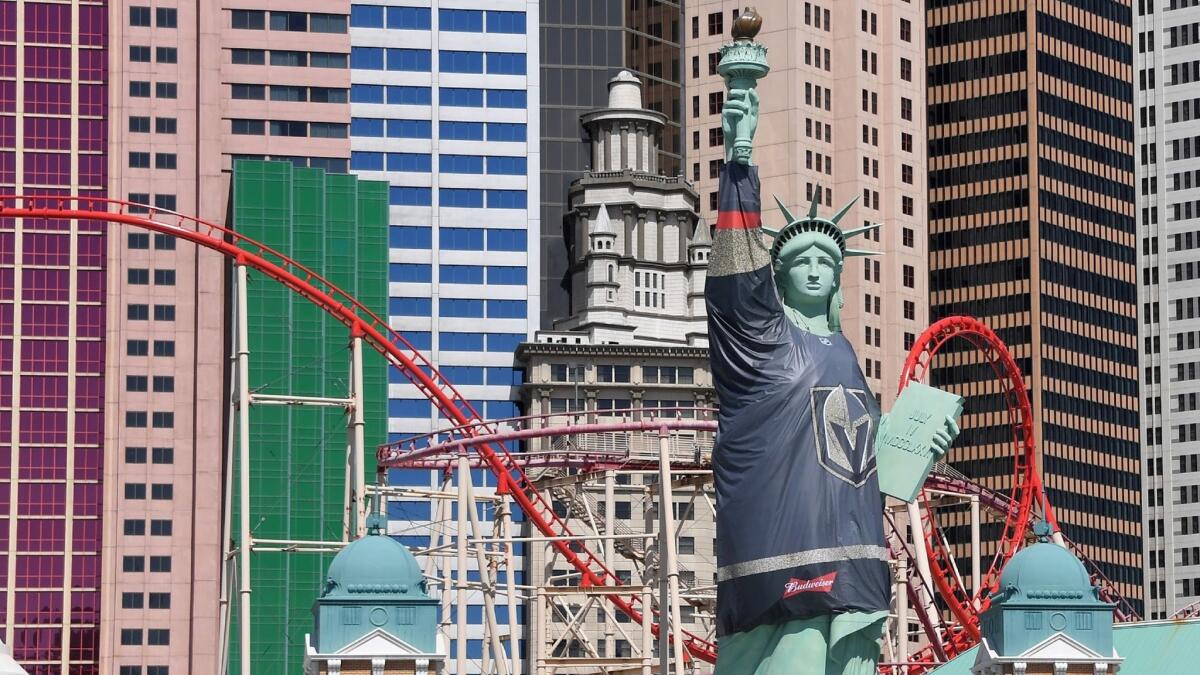 A monster-sized Vegas Golden Knights jersey adorns Lady Liberty outside the New York-New York hotel-casino as the NHL team prepares for the Stanley Cup finals, to be played just down the street.