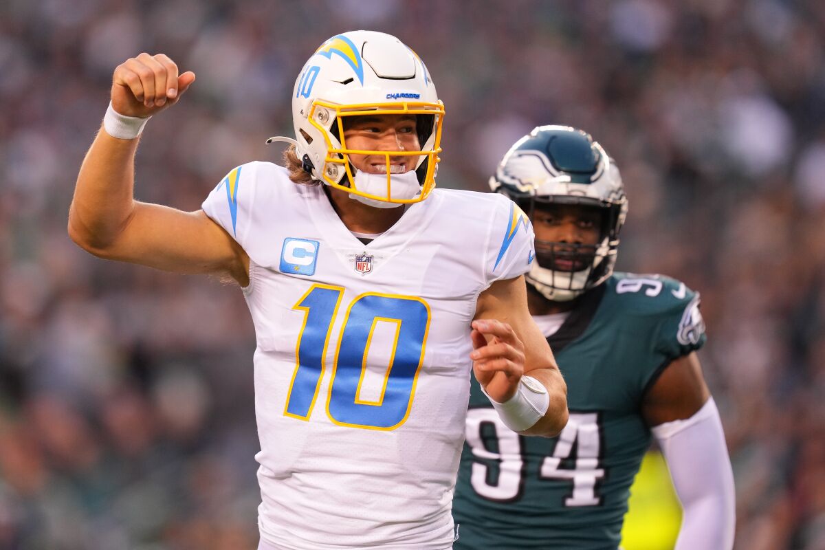 Quarterback Justin Herbert of the Los Angeles Chargers reacts after throwing touchdown pass against the Philadelphia Eagles.