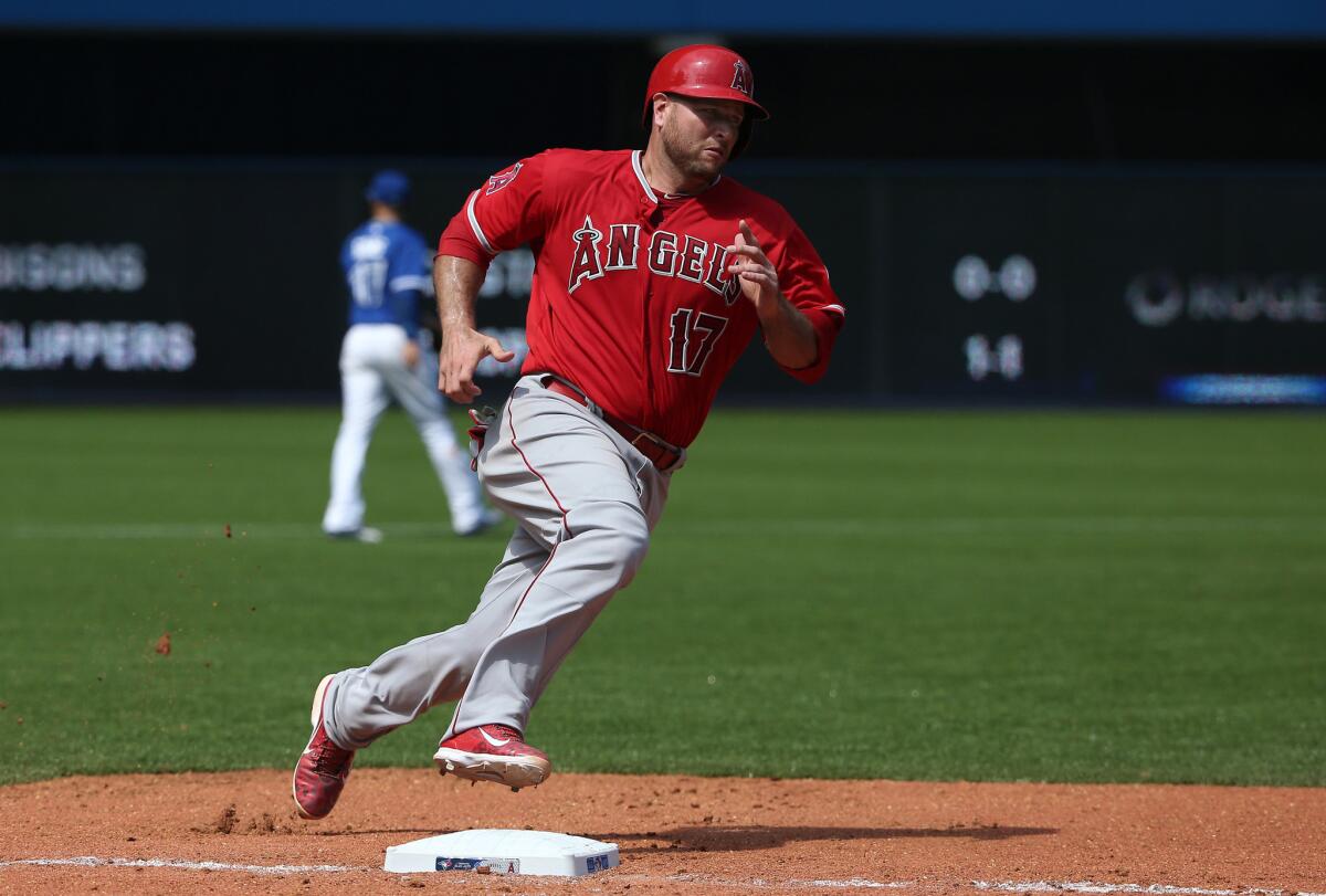 Angels catcher Chris Iannetta rounds third base and heads home on a Johnny Giavotella single in the sixth inning. The Angels lost to the Blue Jays, 10-6.