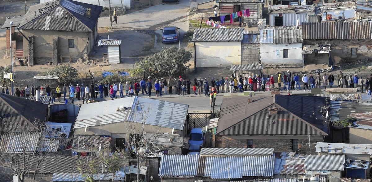 South Africans wait in a long line to vote in Alexandra, north of Johannesburg. An election official said turnout was "extremely high."