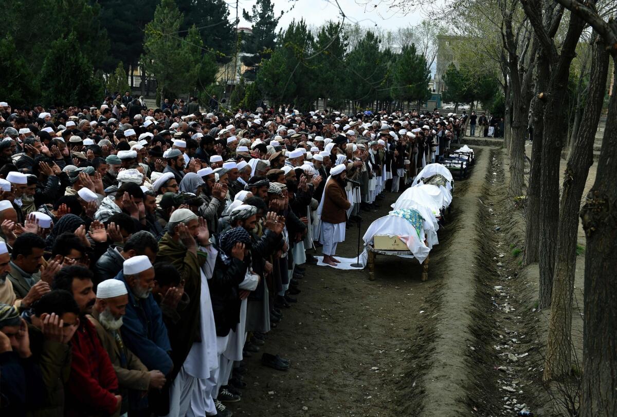 Afghan mourners offer funeral prayers for a family who drowned trying to cross the Aegean Sea between Turkey and Greece. "It was God's will," says Mohammed Ashraf, a tear rolling down his weathered face as he looks at the lifeless bodies of five male relatives recently brought back to Kabul after they drowned trying to reach Europe.