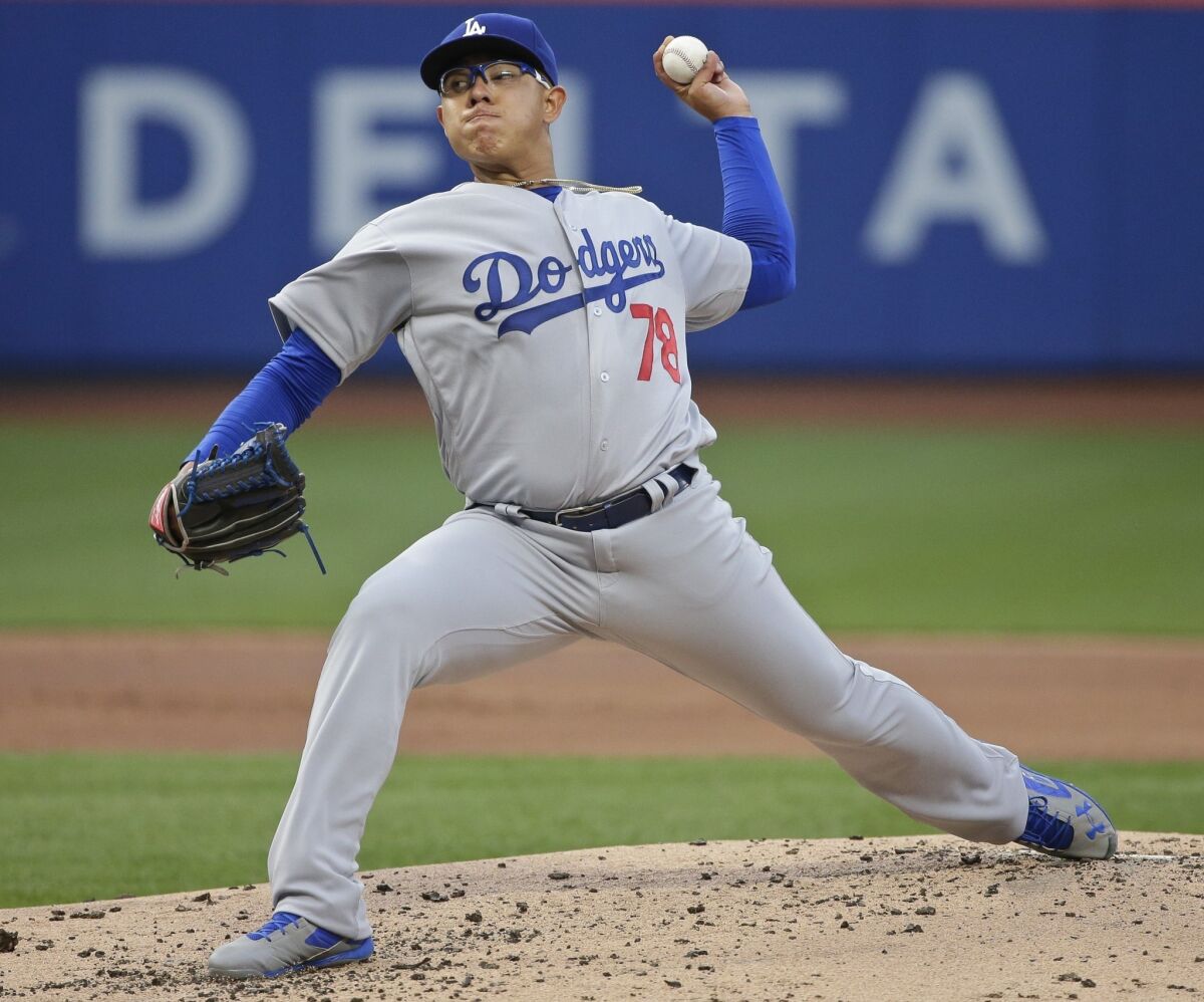 Los Angeles Dodgers' Julio Arias delivers a pitch during the first inning of a baseball game against the New York Mets on Friday, May 27, 2016, in New York.