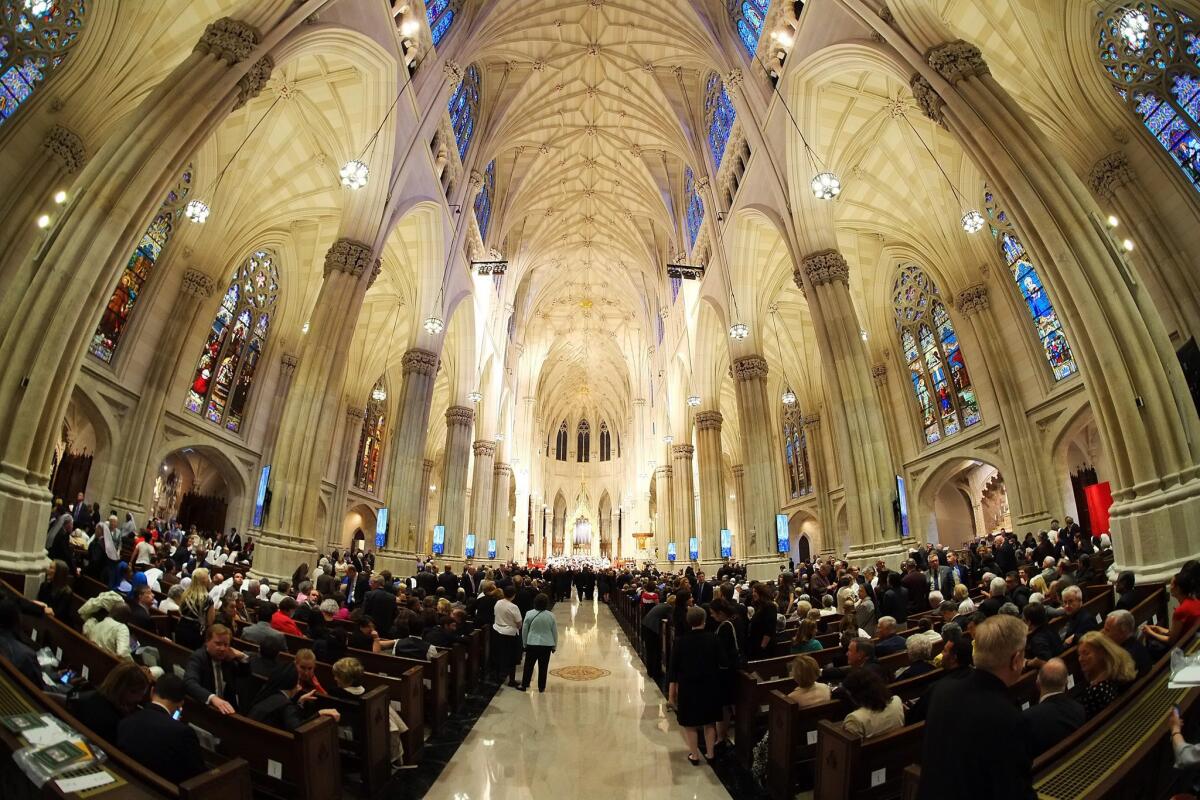 Parishioners wait patiently for Pope Francis to arrive at St. Patrick's Cathedral in Manhattan, New York. EPA/Robert Sabo / POOL
