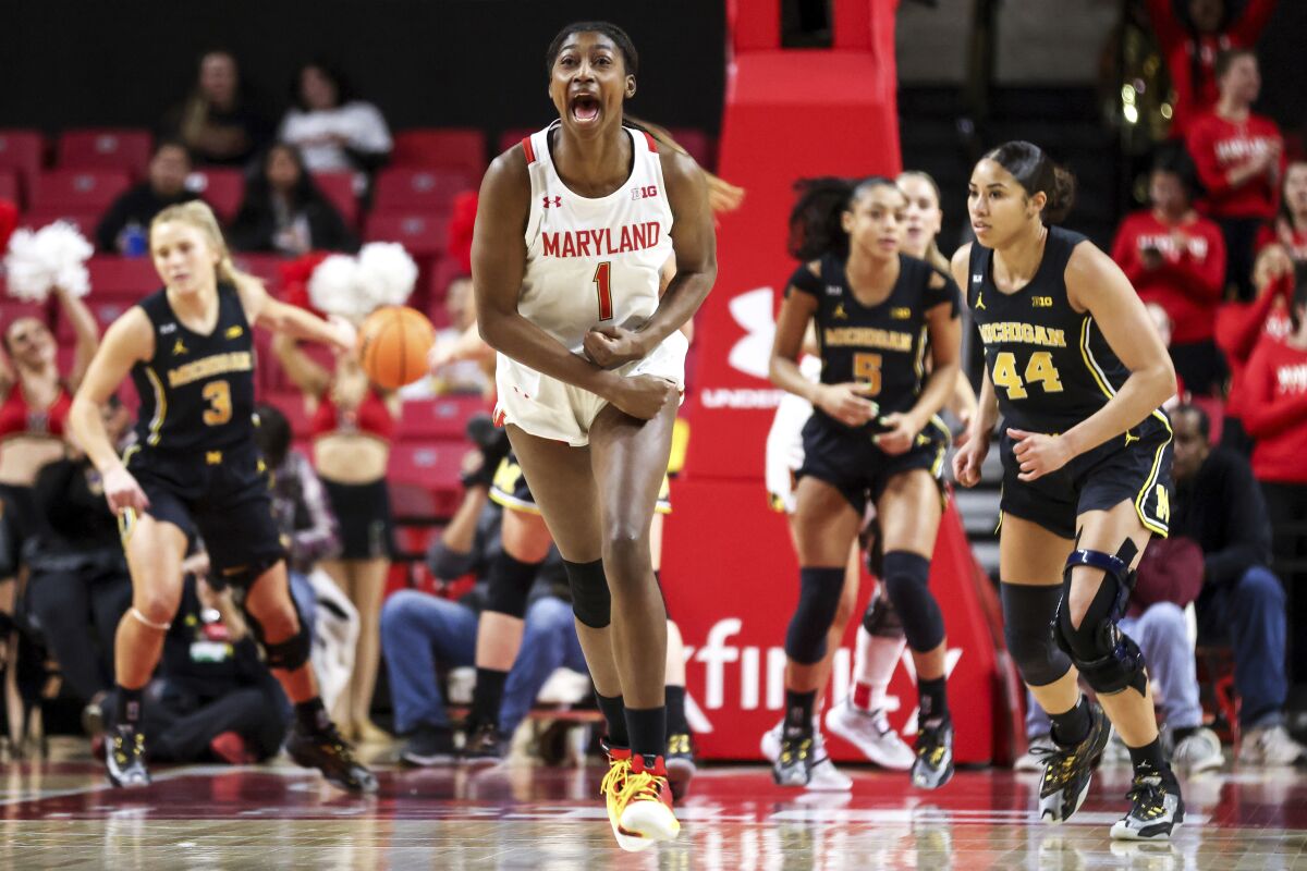 Maryland guard Diamond Miller (1) reacts during the first half of an NCAA college basketball game against Michigan, Thursday, Jan. 26, 2023, in College Park, Md. (AP Photo/Julia Nikhinson)