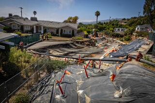 Rancho Palos Verdes, CA - September 01: Severe landslide damage on Dauntless Drive near the Portuguese Bend Community on the Rancho Palos Verdes were an evacuation warning has been issued due to electricity being cut on Sunday, Sept. 1, 2024 in Rancho Palos Verdes, CA. (Jason Armond / Los Angeles Times)