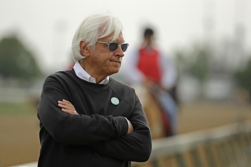 FILE - In this May 1, 2019, file photo, trainer Bob Baffert watches his Kentucky Derby entrant Game Winner during a workout at Churchill Downs in Louisville, Ky. Two-time Triple Crown-winning trainer Bob Baffert, who has had multiple horses test positive in post-race drug testing, is taking steps to “do better,” including hiring outside oversight. Baffert said in a statement Wednesday, Nov. 4, 2020, that he is “very aware” of the incidents involving his horses and the impact that it's had on his family, the sport and himself. (AP Photo/Charlie Riedel)