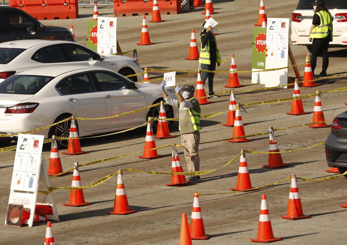 CORE employees and volunteers guide motorists through Dodger Stadium COVID-19 test site in January