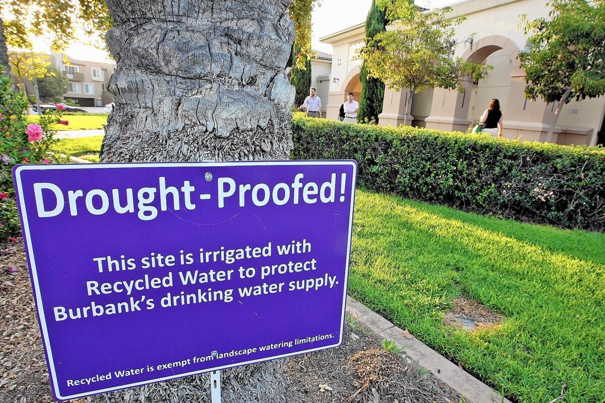 A sign outside of the Buena Vista branch of the library indicates the landscaping is being irrigated with recycled water.