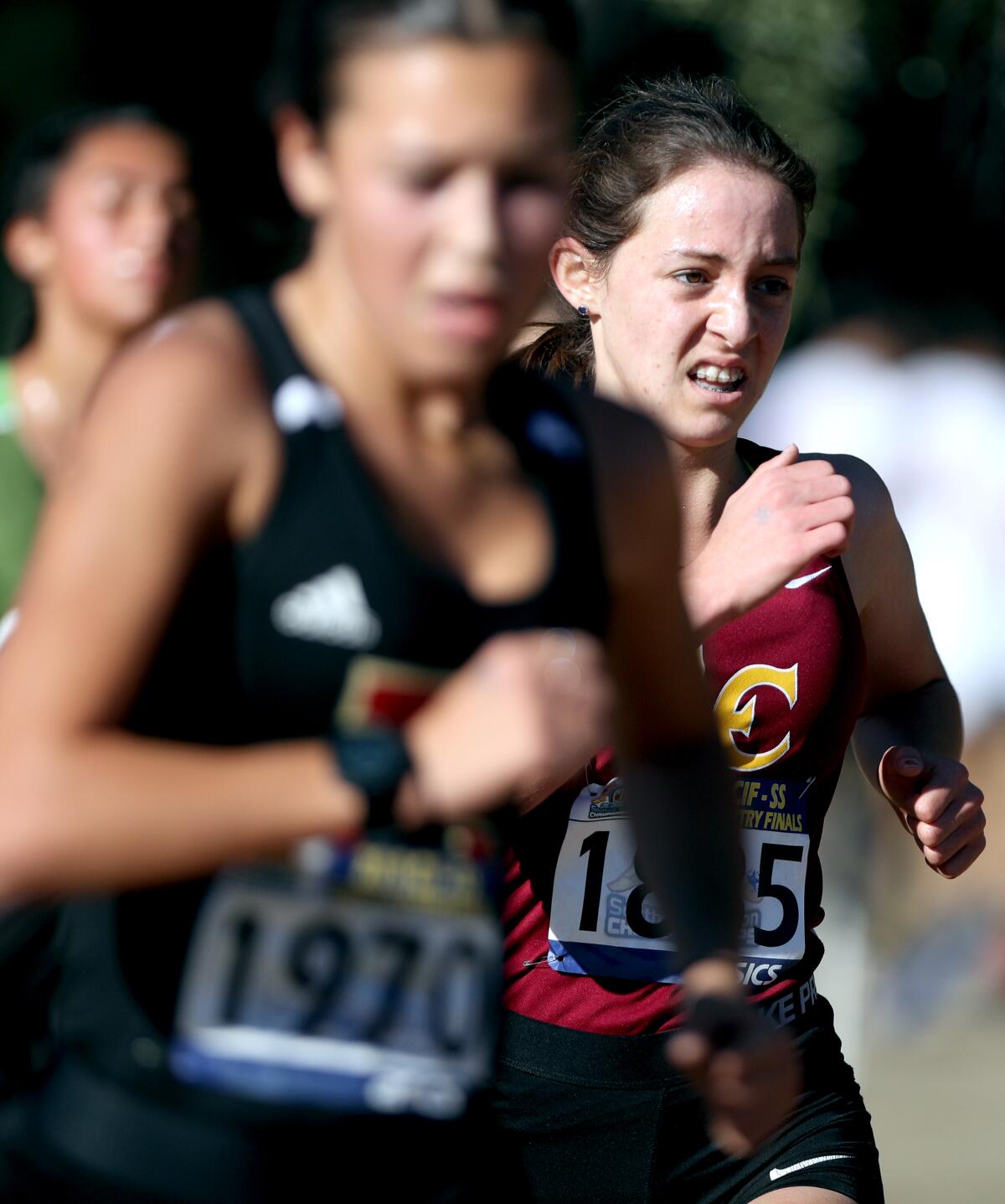 La Canada junior Ellaney Matarese, right, ran in the girls division 4 CIF Southern Section Cross Country Finals, at Riverside City Cross-Country Course in Riverside on Saturday, Nov. 23, 2019.