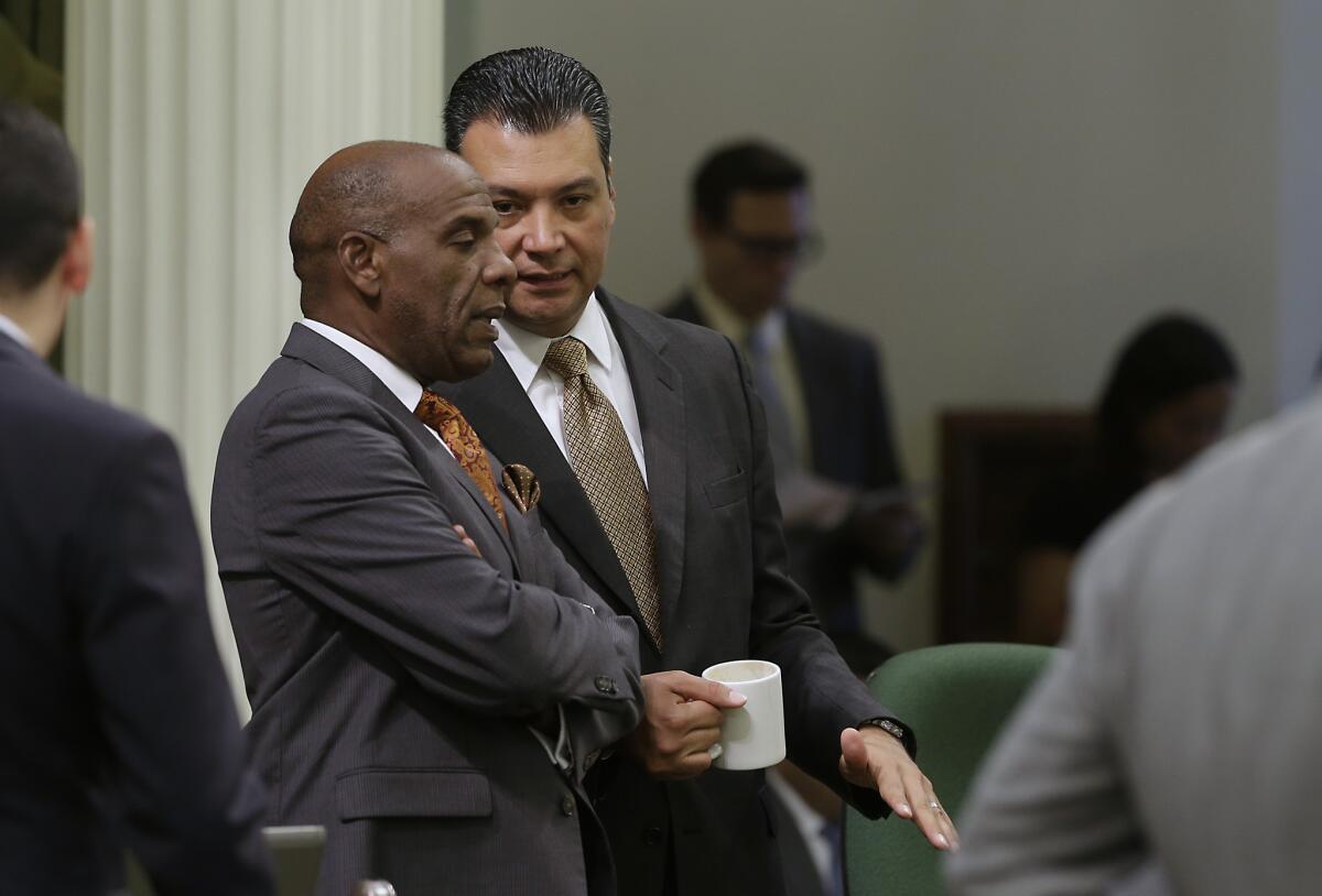 Assemblyman Steven Bradford (D-Gardena), shown at left in August with state Sen. Alex Padilla (D-Pacoima), said he won't run in a Dec. 9 special election for an open state Senate seat.