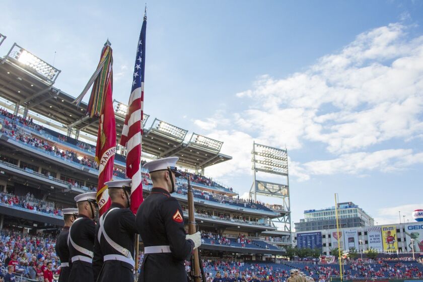 U.S. Marines with Marine Barracks Washington present colors before a baseball game at Nationals Park, Washington, D.C., July 25, 2017. Commandant of the Marine Corps Gen. Robert B. Neller threw the first pitch during the annual Marine Night at the ballpark. (U.S. Marine Corps photo by Cpl. Samantha K. Braun)