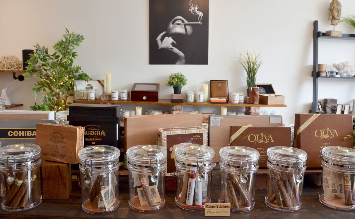 J & S Makescents on Balboa Island combines candles and cigars in the new store.