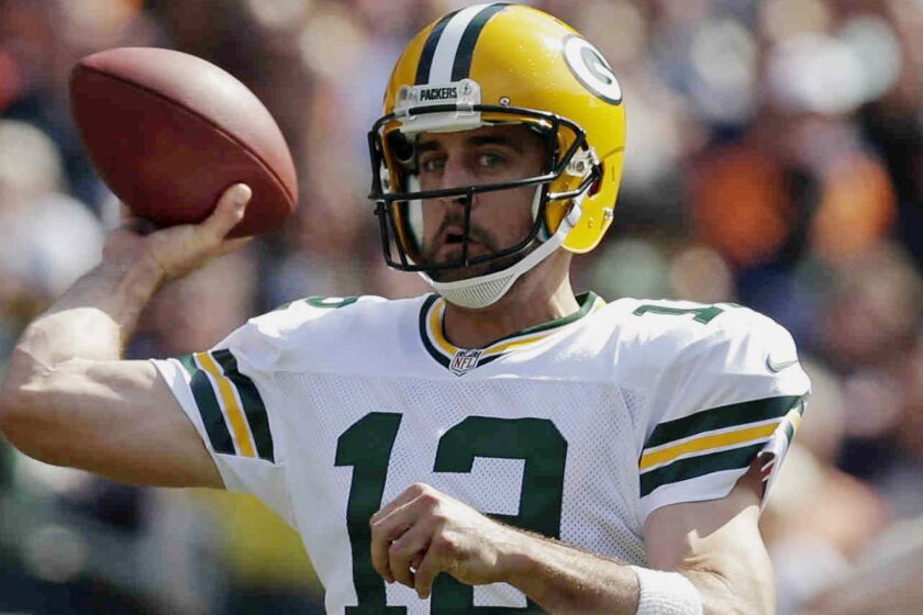 Green Bay Packers quarterback Aaron Rodgers passes during the first half of a 38-17 win over the Chicago Bears on Sunday.