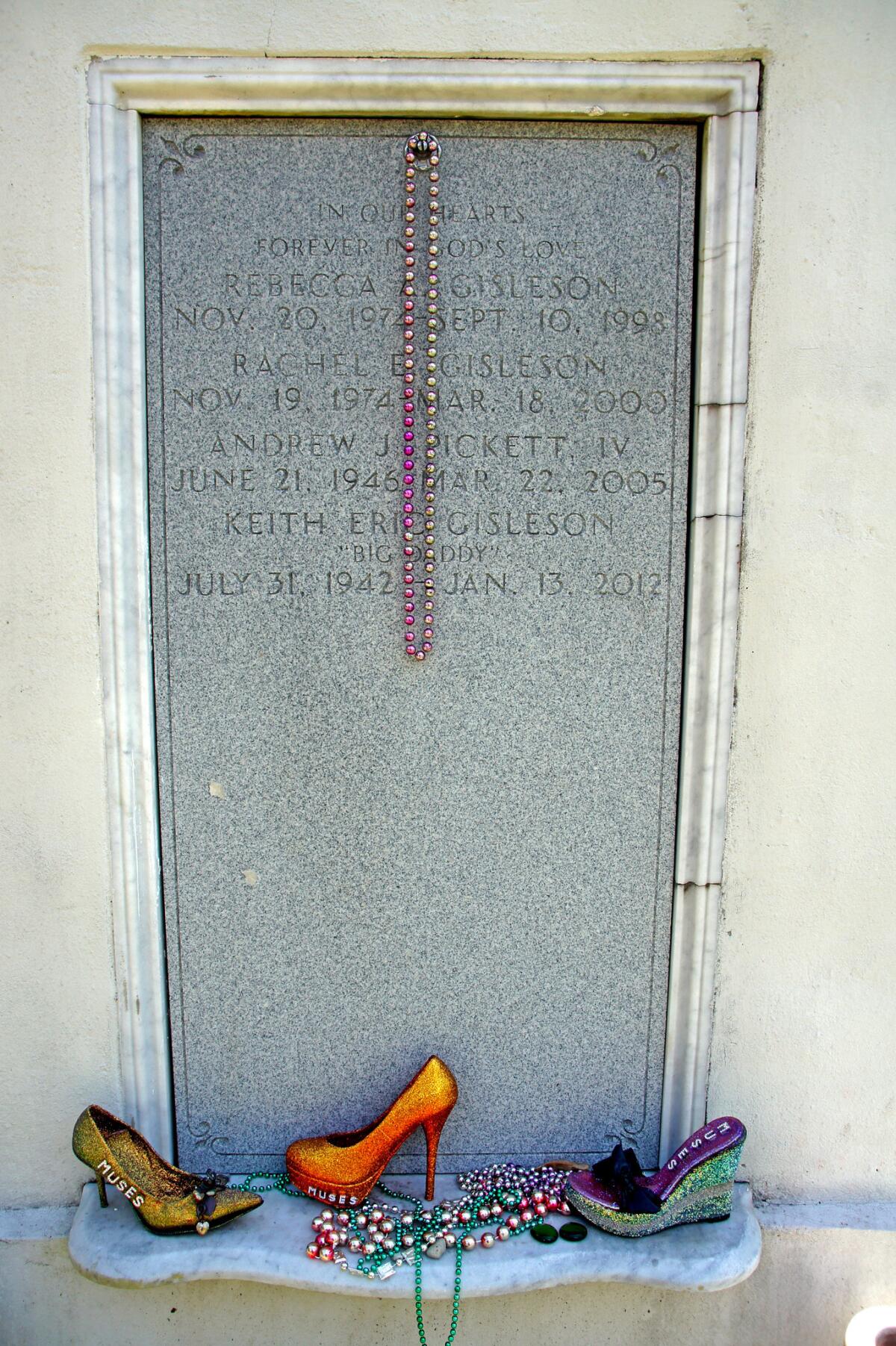 Beads and shoes thrown from the women's Carnival krewe of Muses adorn this tomb in Lafayette Cemetery No. 1 in New Orleans.