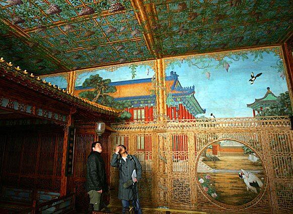 Reporters get a close look at the tiny two-story lodge known as Juanqinzhai in China's Forbidden City. The lodge was restored by a U.S.-Chinese team in an instance of cooperation for the sake of art history. The studio was built in the 1770s by the Qianlong emperor for his personal use after his retirement.