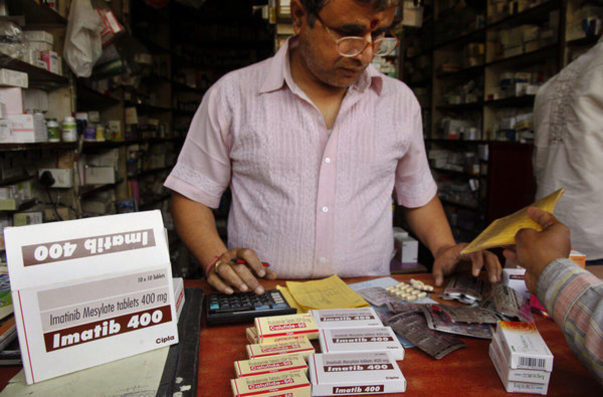 An Indian shopkeeper sells cancer drugs by Indian generic drug manufacturer Cipla in Allahabad, India, on Monday.