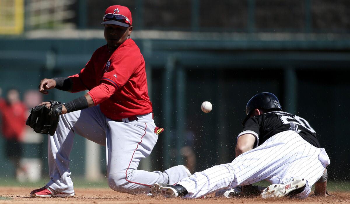 White Sox's J.B. Shuck is safe at second after Angels shortstop Erick Aybar misses the throw during the White Sox's 5-3 spring training win over the Angels on Sunday.