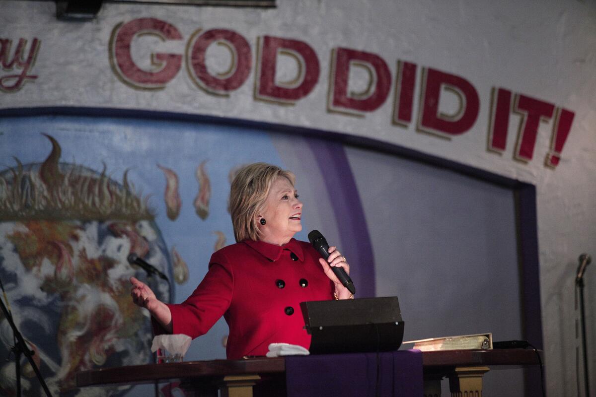 Democratic presidential candidate Hillary Clinton speaks at the Holy Ghost Cathedral in Detroit. Clinton visited three predominantly black churches on Sunday.