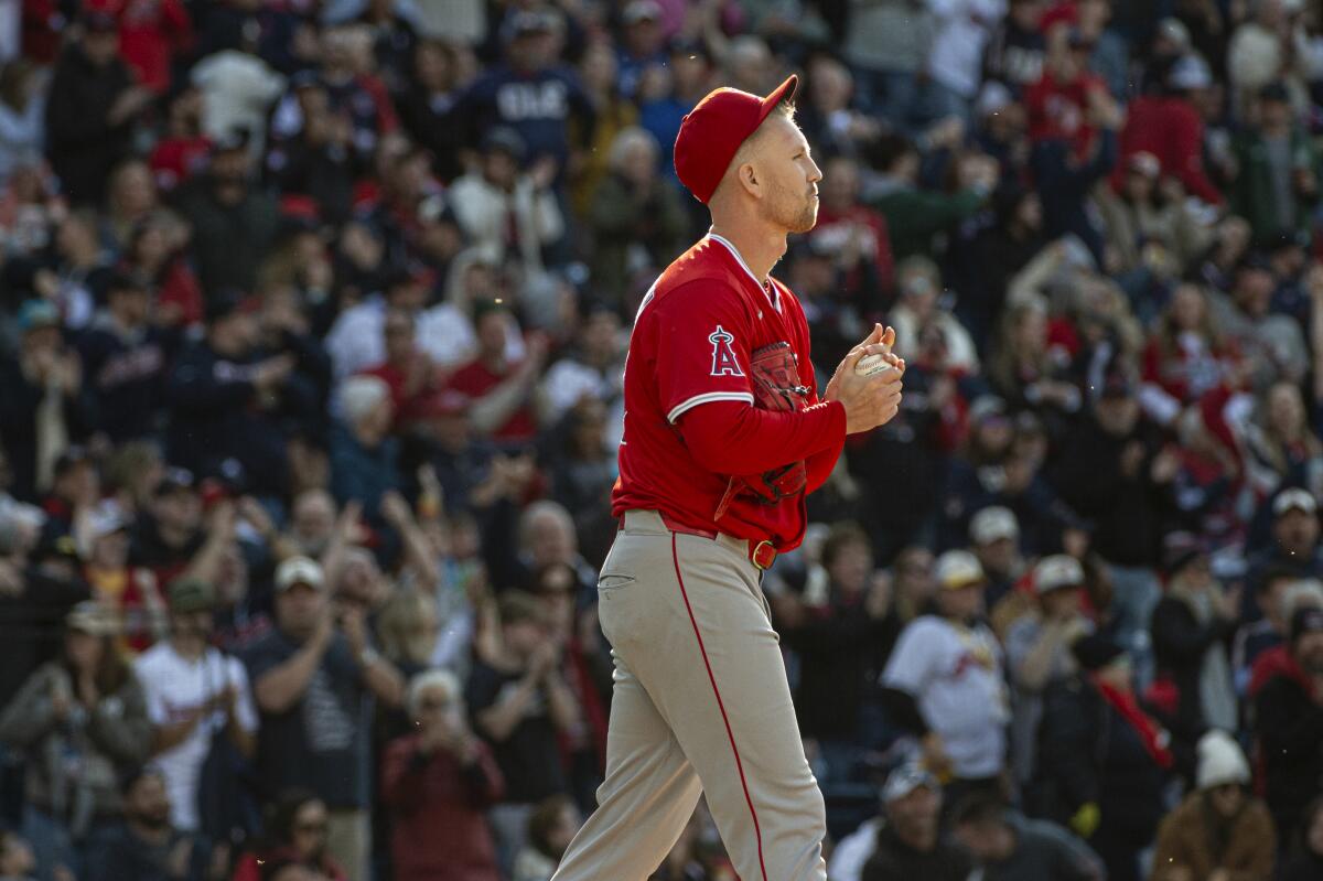Angels reliever Ryan Zeferjahn walks back to the mound after giving up a solo home run to Cleveland's Carlos Santana.