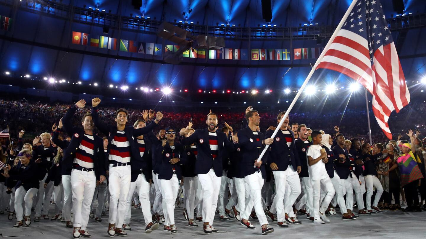 Michael Phelps carries the flag of the United States during the Rio Olympics opening ceremony.
