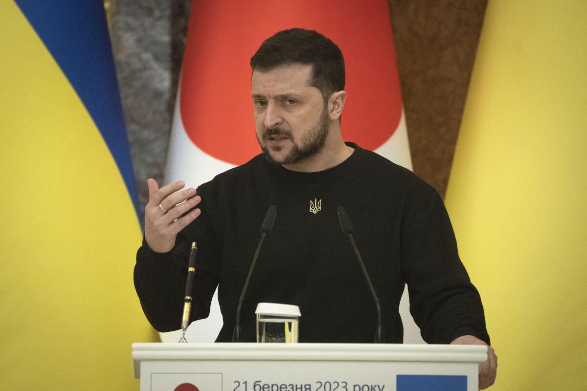 Ukrainian President Volodymyr Zelensky speaking at a lectern