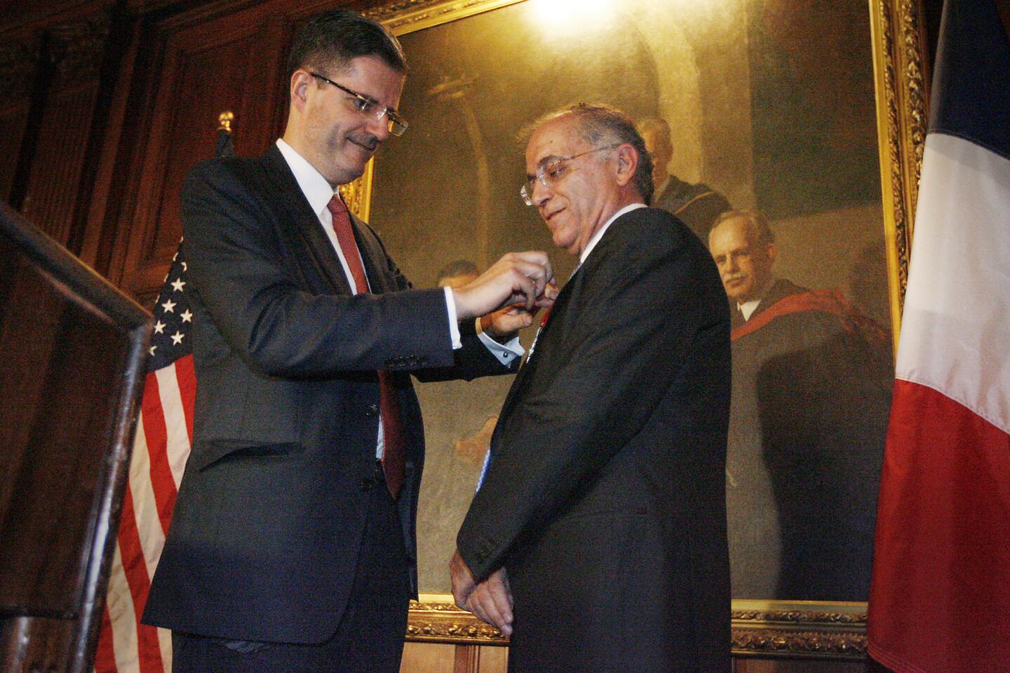 Ambassador of France, Francois Delattre, left, inducts Dr. Charles Elachi, director of NASA¿s Jet Propulsion Laboratory and vice president of the California Institute of Technology in Pasadena, into the Chevalier de la Legion d¿Honneur during a ceremony at Caltech on Tuesday, September 6, 2011.
